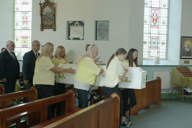The coffin of Aoife O'Brien being accompanied to the altar