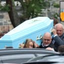 Pallbearers carry the coffin of the late Bryan Lowe this Saturday morning. The teenager, inset, lost his life as a result of a hit-and-run last weekend 