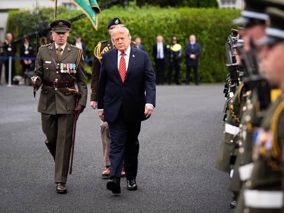 Donald Trump inspects a guard of honour during his visit to Dublin