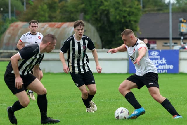 Mungret Regional's Kian Barry on the attack against Janesboro's Stephen Bradley during their LDL Premier League game