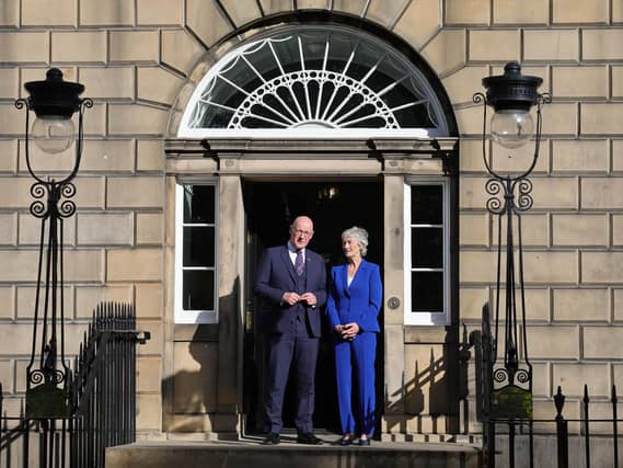 Catherine Connolly and John Swinney outside the door to Bute House