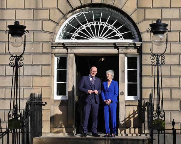 Catherine Connolly and John Swinney outside the door to Bute House