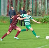 Pike Rovers player Dylan Murphy  holding  possession against Dean McNamara, Summerville Rovers in their Munster Junior Cup tie at Portland Park