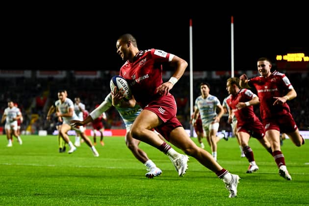 Shay McCarthy of Munster runs in his side's second try during the Investec Champions Cup Round 1 match against Racing 92