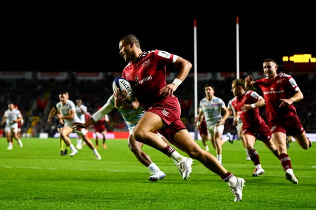 Shay McCarthy of Munster runs in his side's second try during the Investec Champions Cup Round 1 match against Racing 92