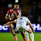 Alex Nankivell is tackled by Antoine Latrasse of Racing 92 during the Investec Champions Cup Round 1 match between Munster and Racing 92 at SuperValu Páirc Uí Chaoimh