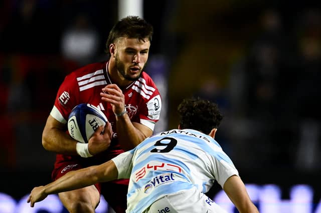 Alex Nankivell is tackled by Antoine Latrasse of Racing 92 during the Investec Champions Cup Round 1 match between Munster and Racing 92 at SuperValu Páirc Uí Chaoimh