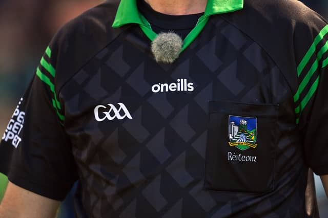 A TG4 sound microphone on referee John O'Halloran before the Kerry County Senior Hurling Championship final in 2022