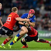 Gavin Coombes, left, and Edwin Edogbo of Munster tackle Leinster's Josh van der Flier in last season's game at the Aviva Stadium