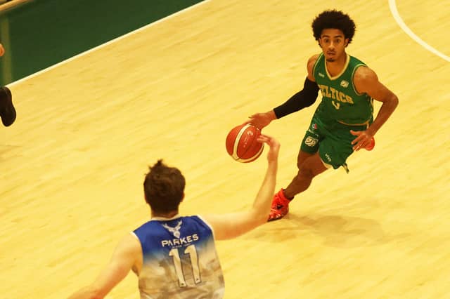 Sebastian Cole, Limerick Celtics in possession of the ball against Alex Carlisle of Limerick Eagles in the Men's Super League Limerick derby at UL Arena