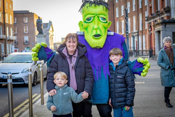 Olivia Hannon with Jay and Tyrell Kelly trick-or-treat with Frankenstein at the Home of Halloween event held last weekend in the city