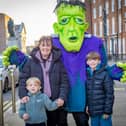 Olivia Hannon with Jay and Tyrell Kelly trick-or-treat with Frankenstein at the Home of Halloween event held last weekend in the city