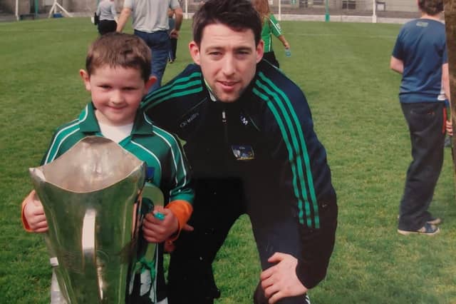 Graeme Mulcahy with a young Jackie Dwane after Kilmallock won the Limerick SHC in 2014. The pair played in last Sunday's victory over Na Piarsaigh at the TUS Gaelic Grounds