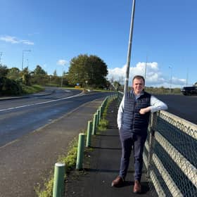 Cllr Dan McSweeney stands on the site of the proposed bus shelter in Clarina