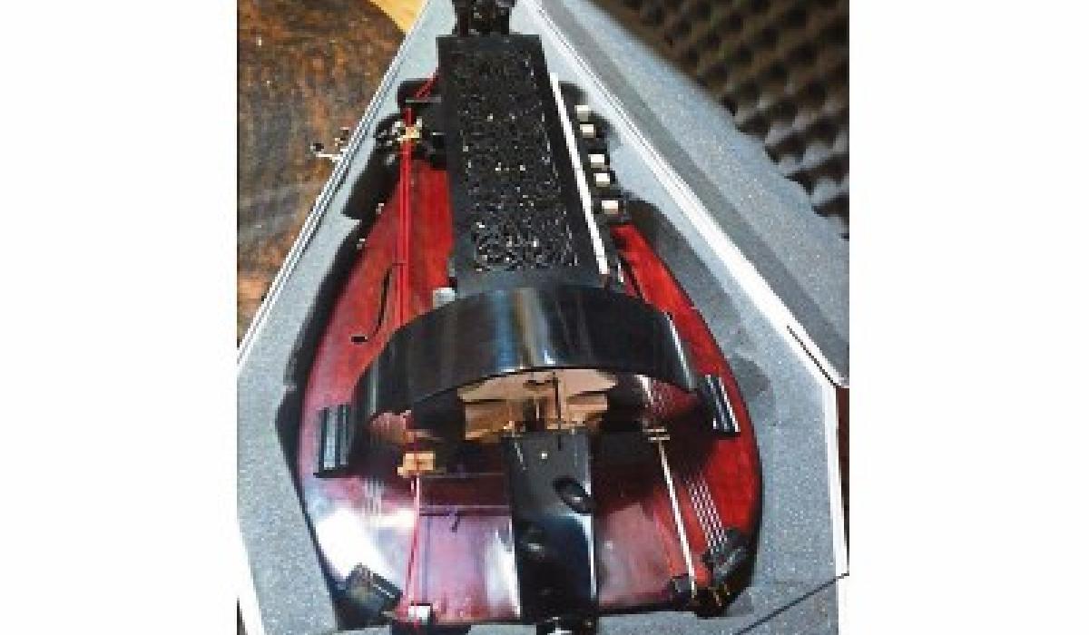 Hurdy musical instrument crossword