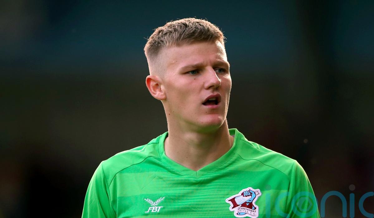 Jake Eastwood saves penalty on Grimsby debut to earn point against AFC Wimbledon