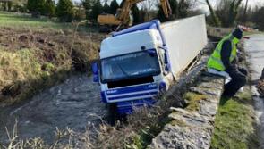 Truck crashes through wall into Limerick river