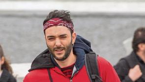 Fan leaves bandana on Dolores O’Riordan’s grave in Limerick to end emotional year