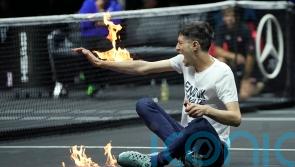 Players stunned as protester sets arm on fire in dramatic incident at Laver Cup