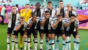 Germany risk disciplinary action by covering mouths in protest at armband threat