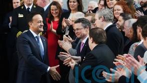 Rapturous applause and Bon Jovi song feature during historic handover of power
