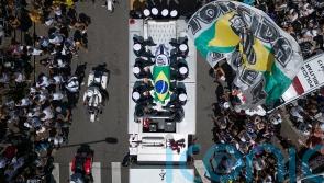 Thousands line streets to bid final farewell to Brazil great Pele