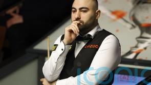 Hossein Vafaei storms past Ding Junhui to set up Ronnie O’Sullivan showdown