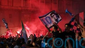 Napoli’s fans light up the sky as they celebrate Serie A title win