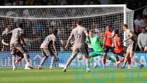 Micky van de Ven scores as 10-man Tottenham go top with win over Luton
