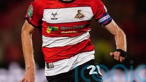 Ten-man Doncaster secure League Two play-off spot with draw at Gillingham