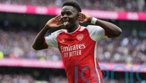 Arsenal withstand Tottenham’s second-half fightback to boost title hopes