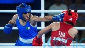 Algerian fans celebrate as Imane Khelif books place in women’s 66kg final