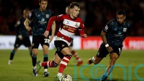 Kyle Hurst brings joy to Grant McCann in Doncaster’s win over Bradford