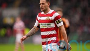 Doncaster clinch promotion after beating 10-man Bradford in incident-packed game