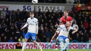 Wrexham maintain promotion push with battling win over Portsmouth
