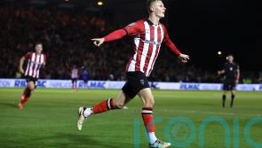 Lincoln leapfrog Cardiff at top after victory over title rivals