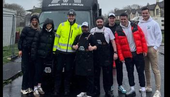 Hurlers Darragh O'Donovan and Kyle Hayes (far right) with presenter Baz Ashwany in high-vis working on the DIY SOS project