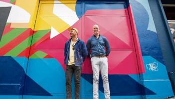 Paul O’Connell representing sponsors TLC with artist Maser, who created the urban art piece unveiled on Thomas Street last week  Picture: Alan Place 