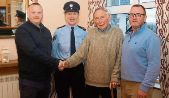 Sgt Helen Holden praises Eugene and Marcus Ryan &ldquo;Alec&rdquo;, Doon, who pulled Paddy McCarthy, Cappamore, out of a burning car Picture: Michael Cowhey