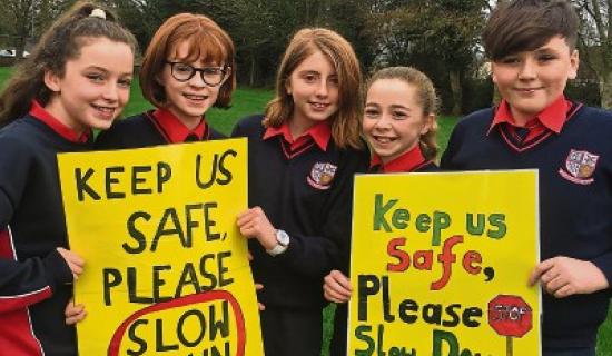 Sarah Prendergast, Freya Mannix, Julianna-Mae Ward, Keelin Power and Ian O'Dea with two of the signs