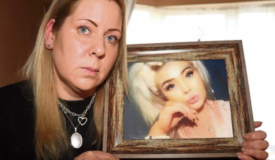   Melanie Sheehan with a picture of her daughter Eve 