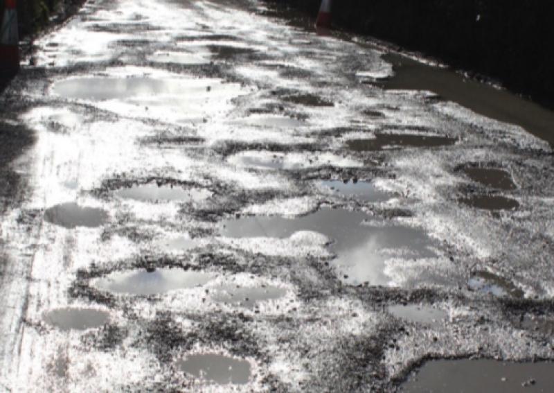 Potholes filling "a waste of money".