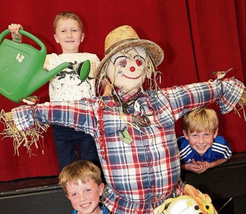 Conor Enright, Adam Molloy and Kevin Sexton getting their scarecrow ready for the Knockaderry Village Fayre Picture: Dave Gaynor