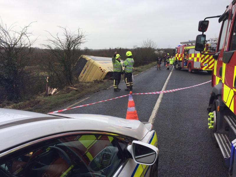 Emergency services respond to crash involving a school bus and two cars in Limerick