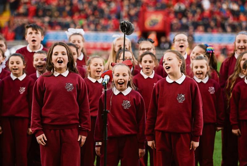 Members of Corpus Christi Choir performing at Thomond Park Picture: Sportsfile