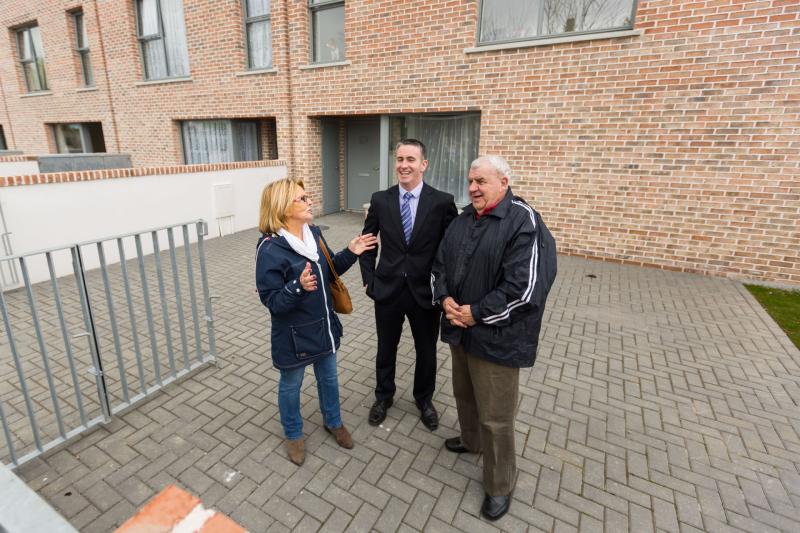 Damien English launching the new housing development in Southill with residents Pam Noonan and Pat Begley Picture: Oisin McHugh/True Media