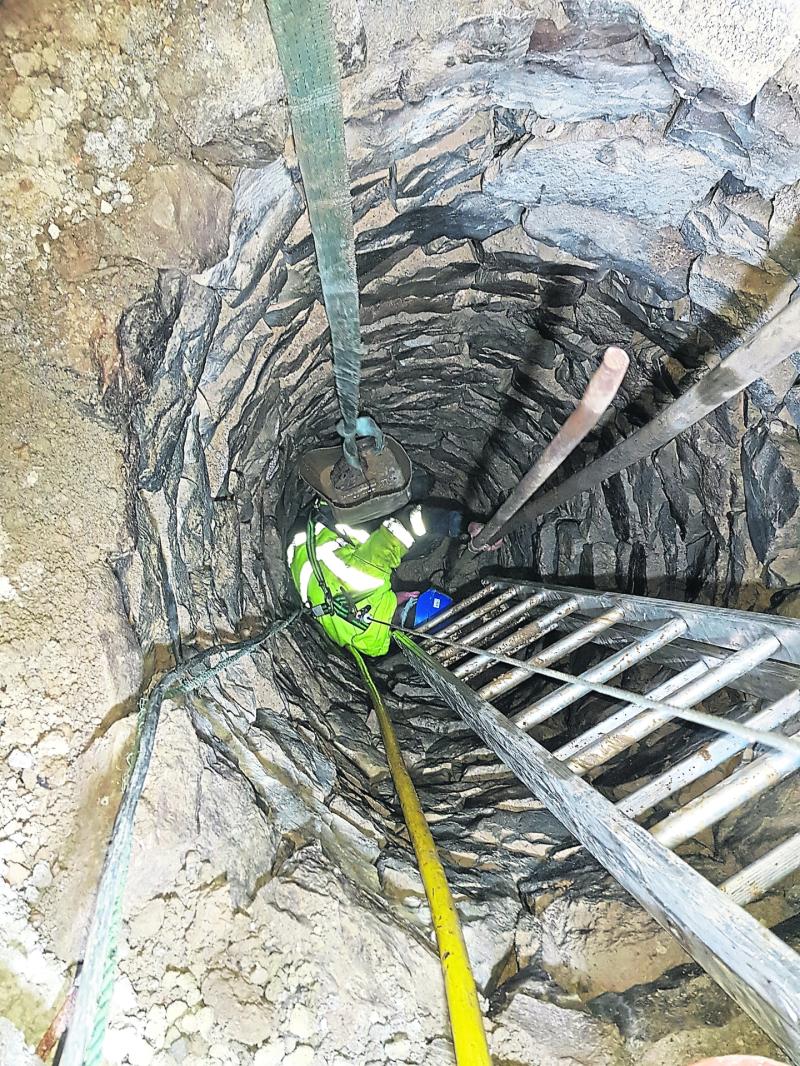 The ancient well and below, Richard O'Donoghue  spreading some water from the well over Fitzgerald Park, Kilmallock this week
