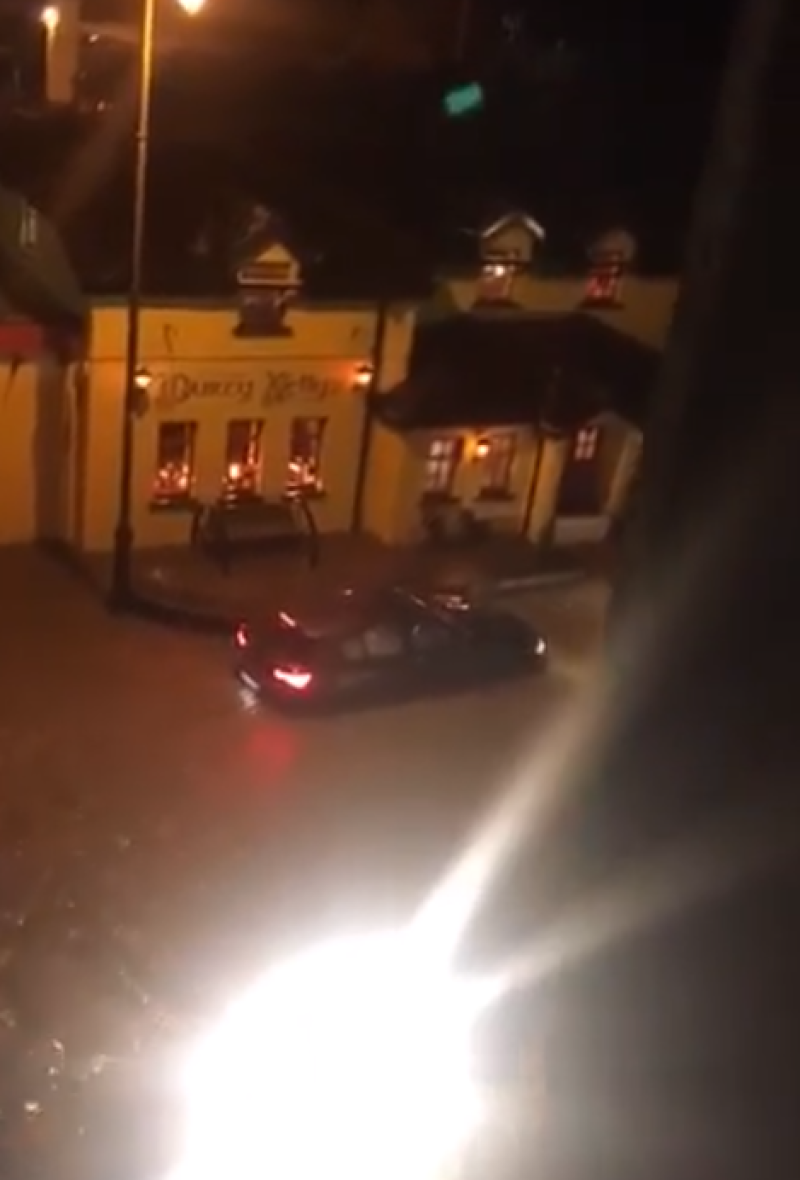 Car left stranded after road floods outside one of Ireland's most well-known bars
