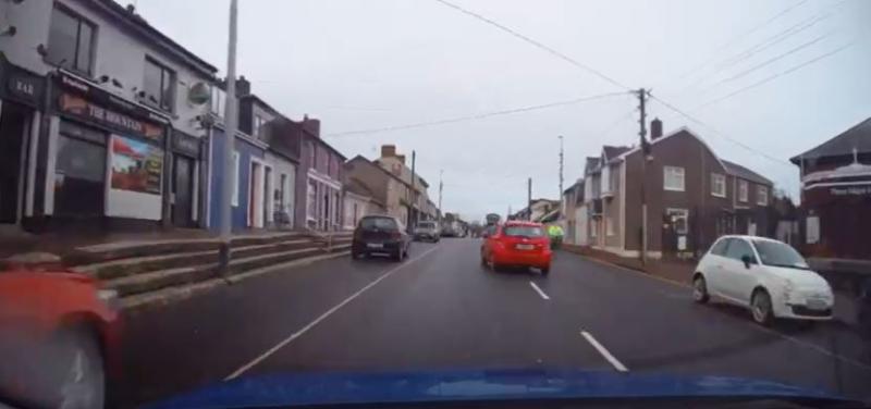 WATCH: Terrifying moment 'maniac' driver nearly collides with cyclist before running red light