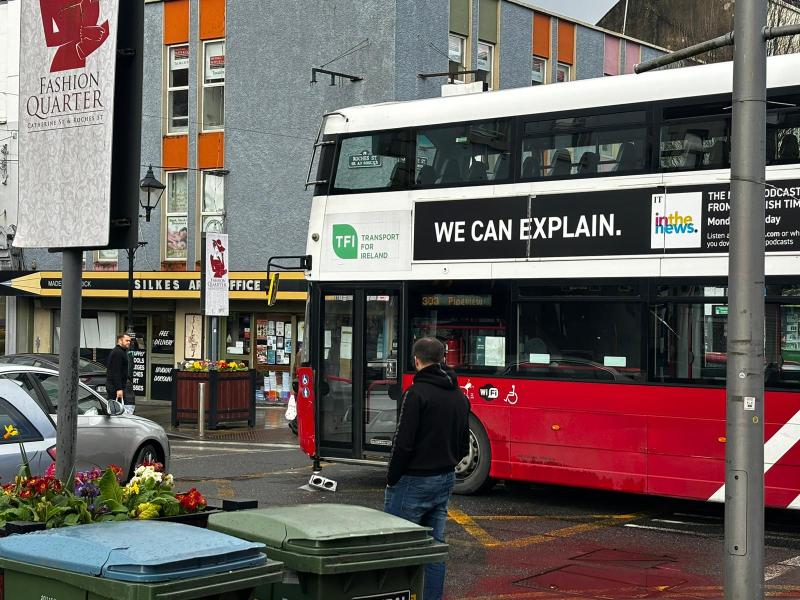 Traffic delays on busy city street as car and bus collide